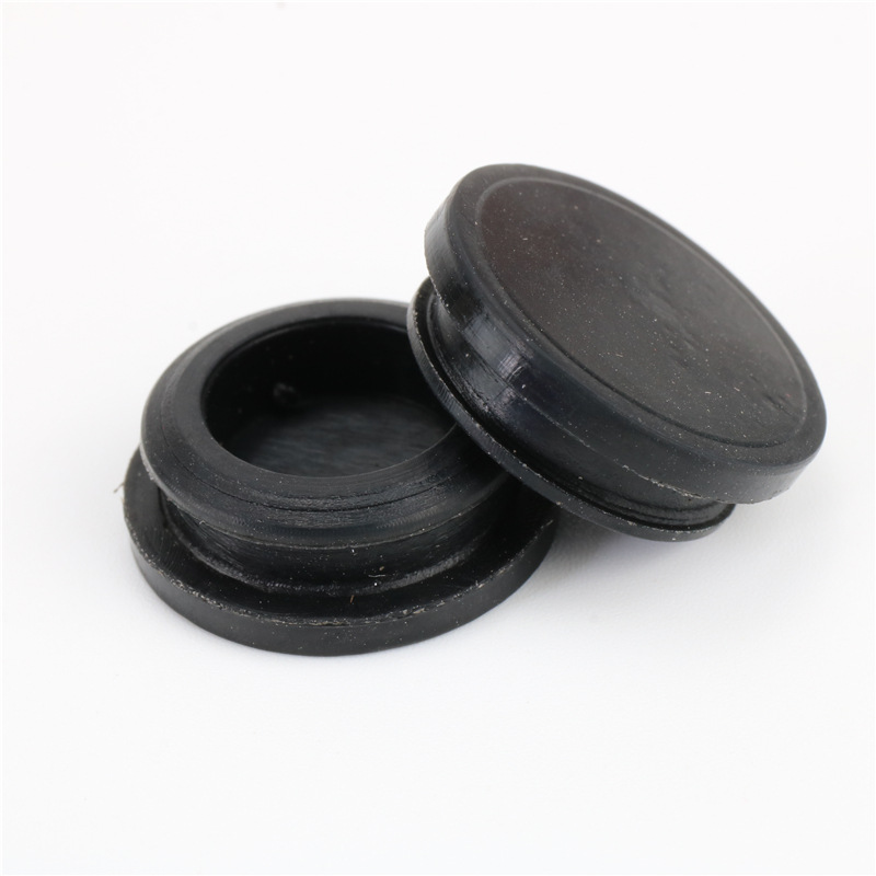 Black round plugs shown from front and reverse angles