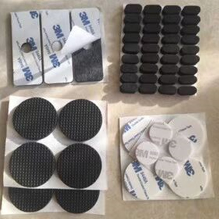 Black round and rectangular EVA foam pads with adhesive release liners