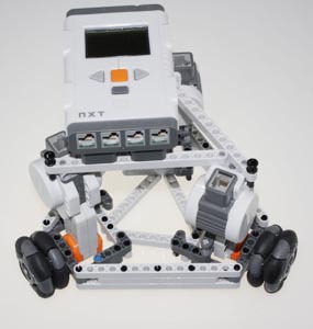 Robot chassis fitted with black omnidirectional wheels