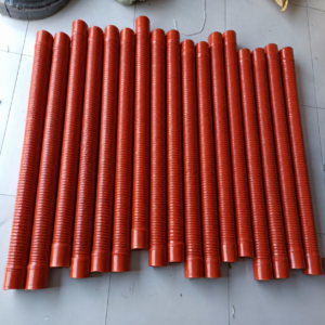 Red reinforced corrugated silicone hoses arranged by size