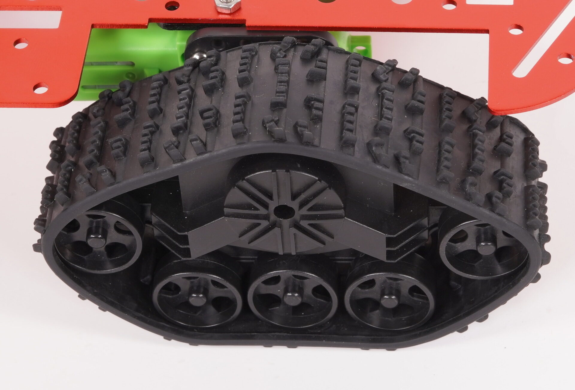 Black rubber tank track and wheels mounted on a robot chassis