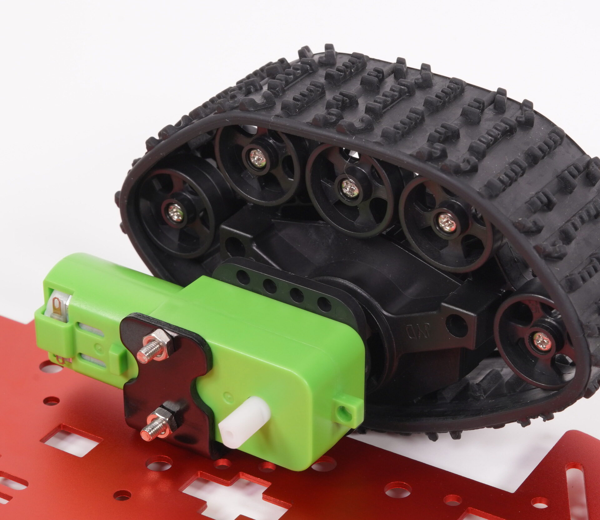 Robot tank track mounted beside a green gearmotor on a red chassis