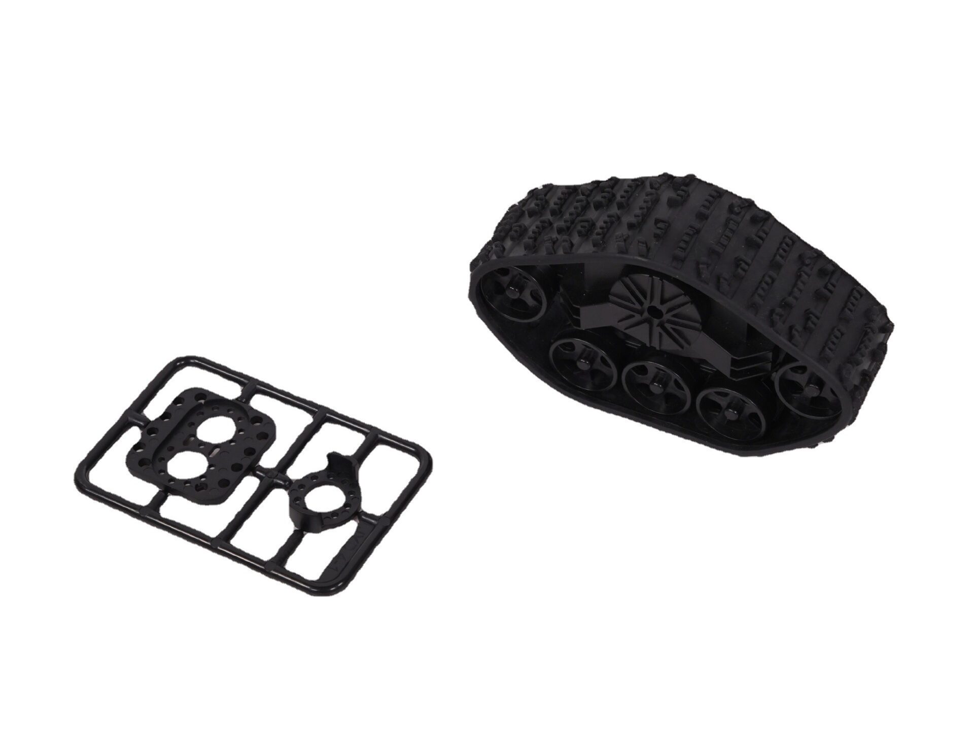 Black robot tank track and plastic mounting parts on a white background