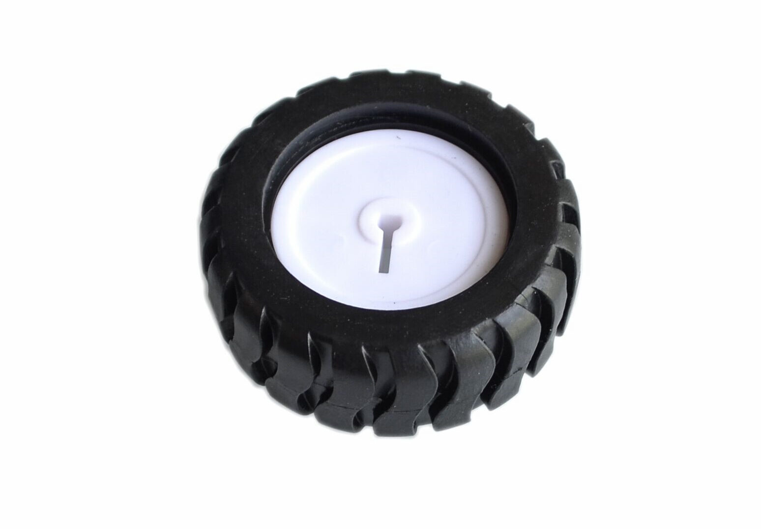 Rear view of a black robot wheel with a white slotted hub
