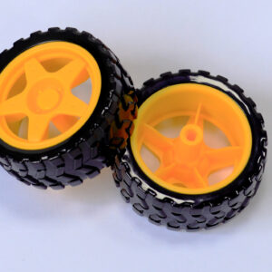 Two black rubber robot wheels with yellow hubs
