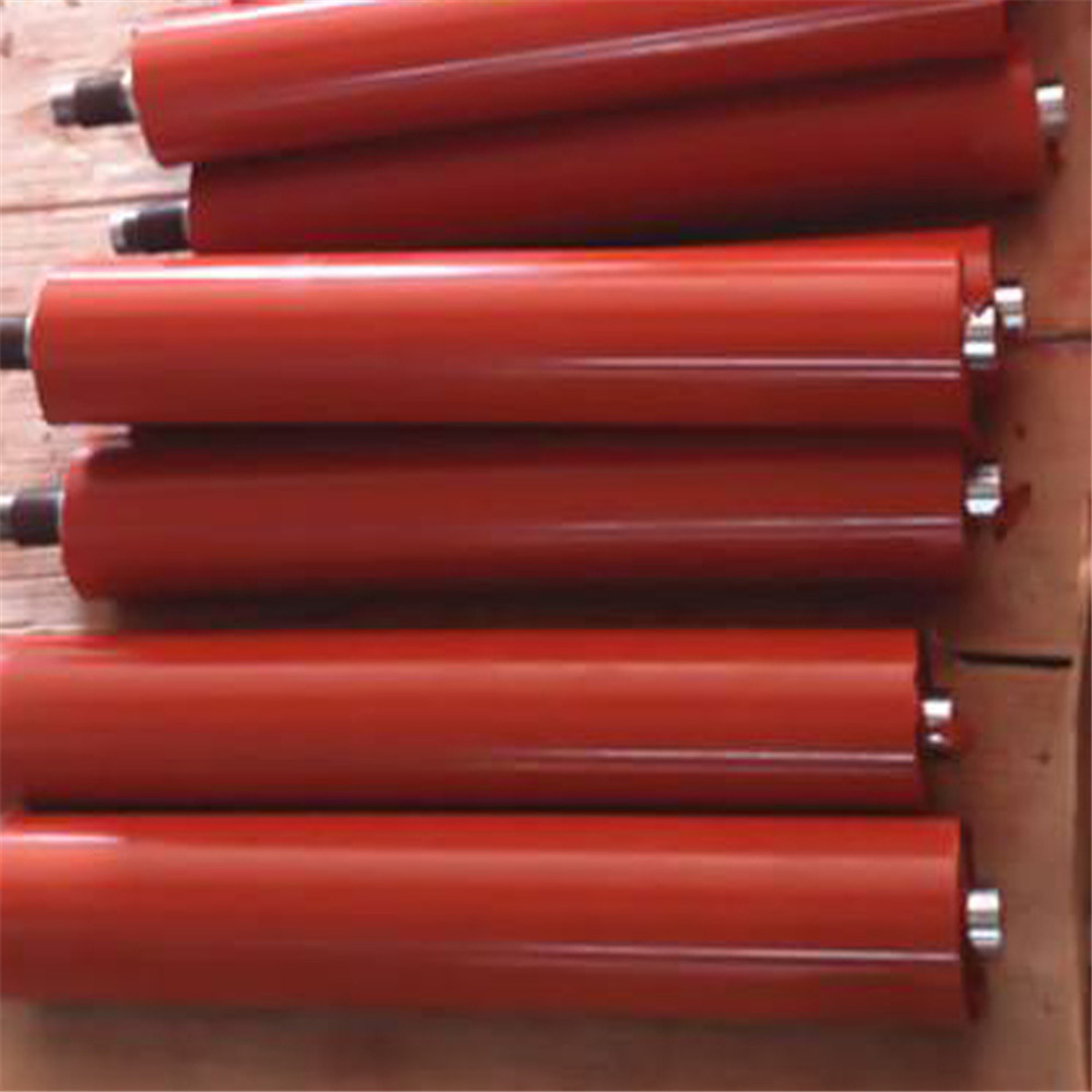 Red rubber-coated rollers with shafts