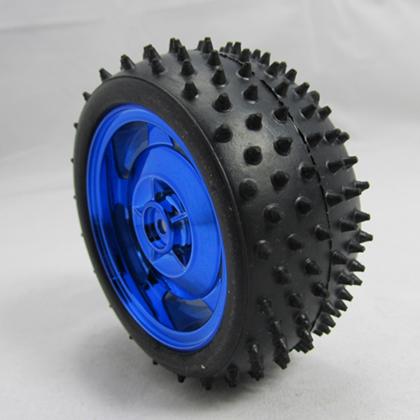 Studded black rubber tyre with a blue wheel hub