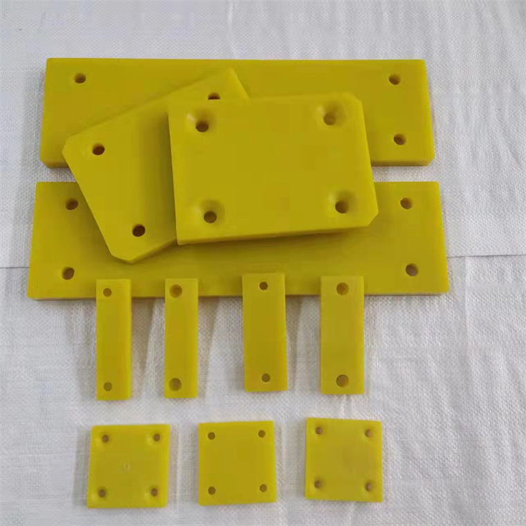 Yellow rectangular protective pads with mounting holes
